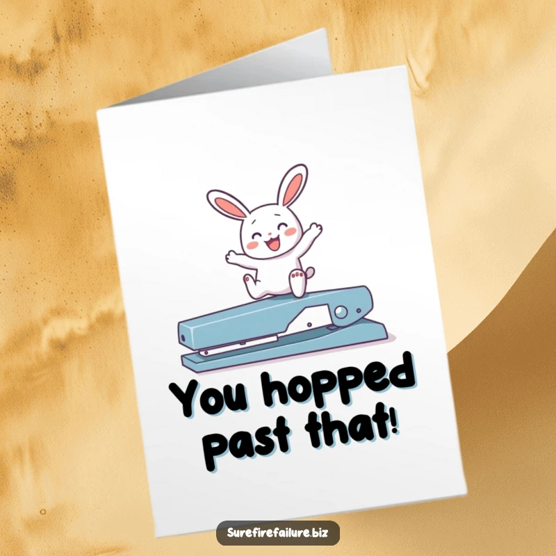 Funny Free Printable congratulations card showing a joyful bunny happily hopping over a broken stapler, celebrating victory.